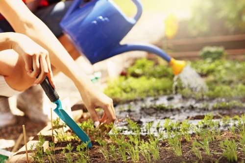 Gardener working safely with tools in a residential garden